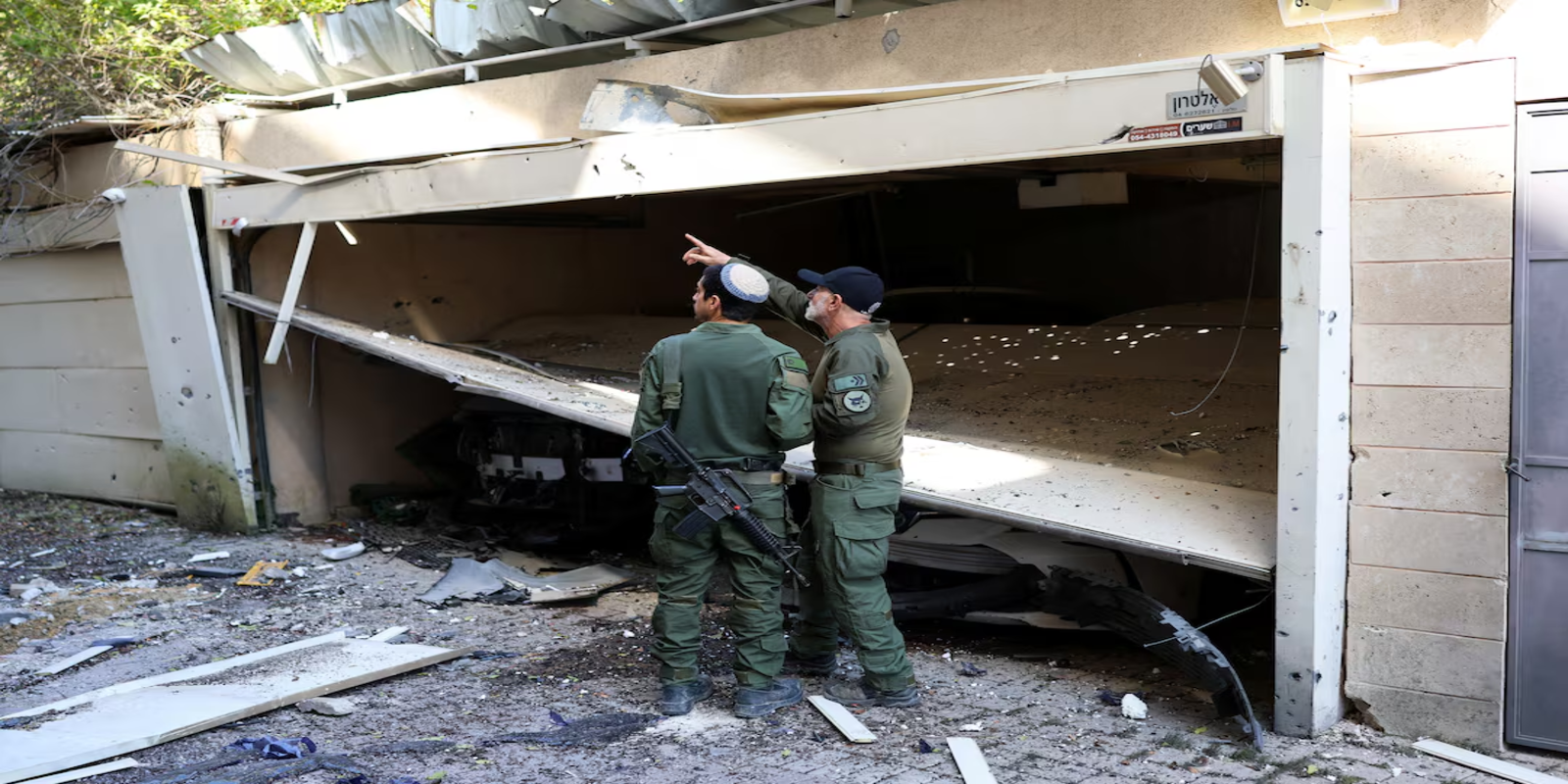 Israeli military says Iranian missiles hit central Israel